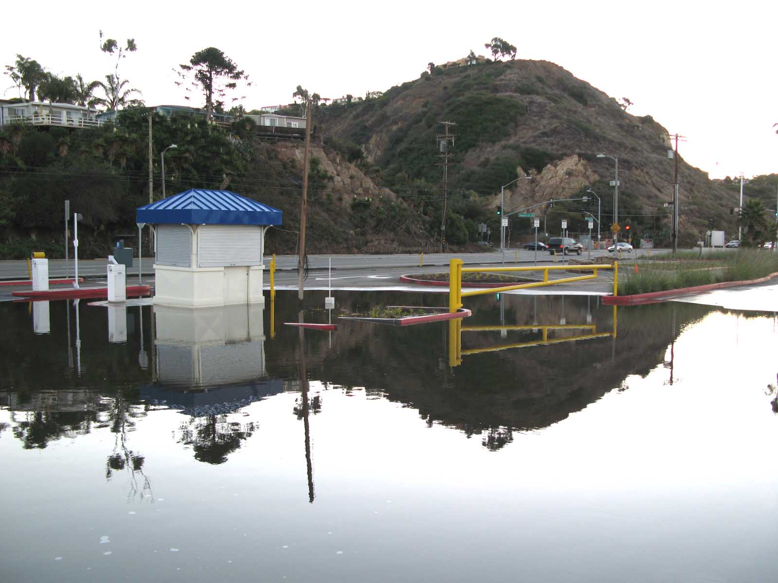 A large swath of the entrance to Will Rogers State Beach at Temescal Canyon Road was flooded six-inches deep for days after the Friday and Saturday rainstorms. The failure of the lot to drain had local residents questioning the quality of the county's recent $13-million improvement project. Photo: Stuart Muller